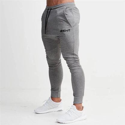 Men's Slim-Fit Jogger Pants with Side Stripes, Drawstring Waist, and Zippered Pockets for Athletic Wear